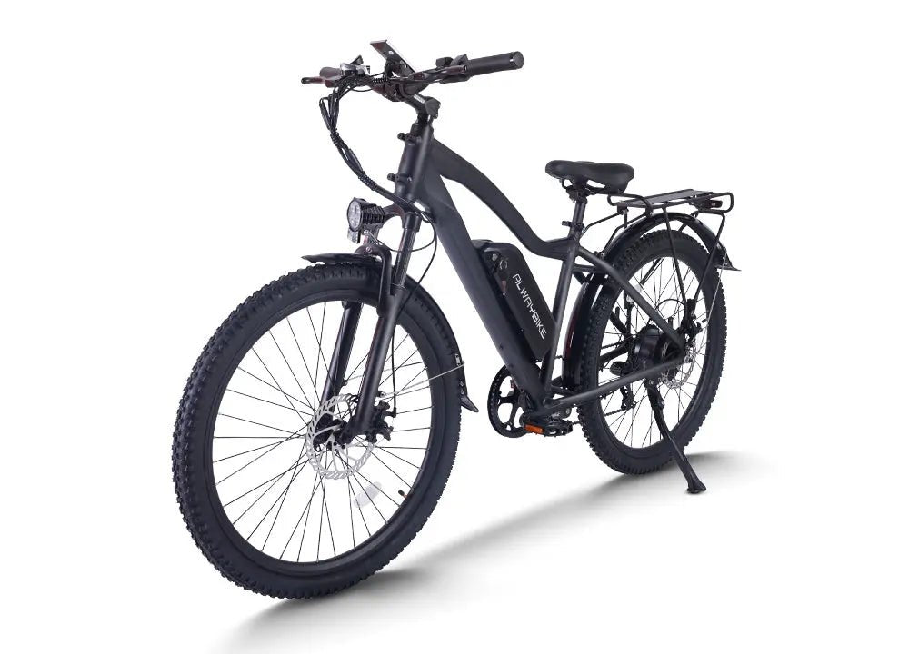 A real electric mountain bike shown outdoors on a mixed-surface route, illustrating the article's terrain-first buying approach.