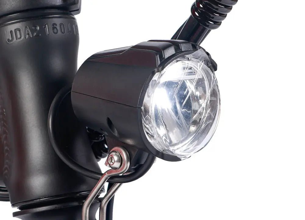 A front-light option shown in a realistic commuter riding context for assessing forward visibility and mounting suitability.